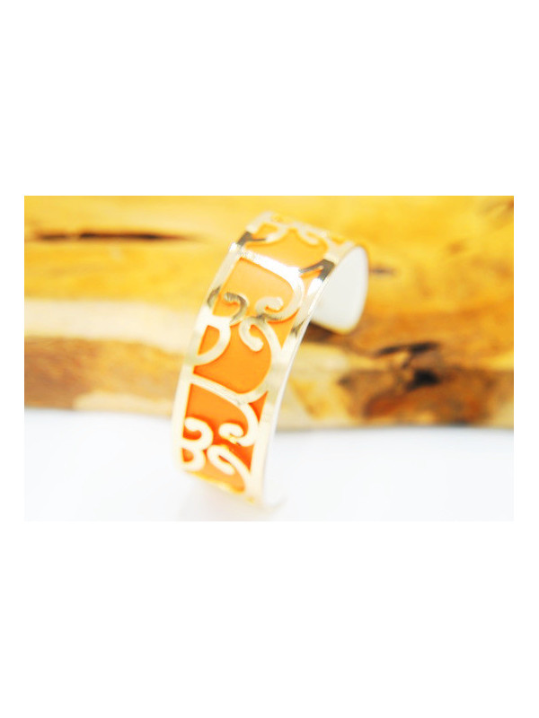 Bracelet fantaisie courbes dorées fond orange 
