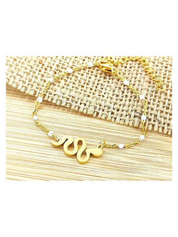 Bracelet Acier serpent doré perles blanches 